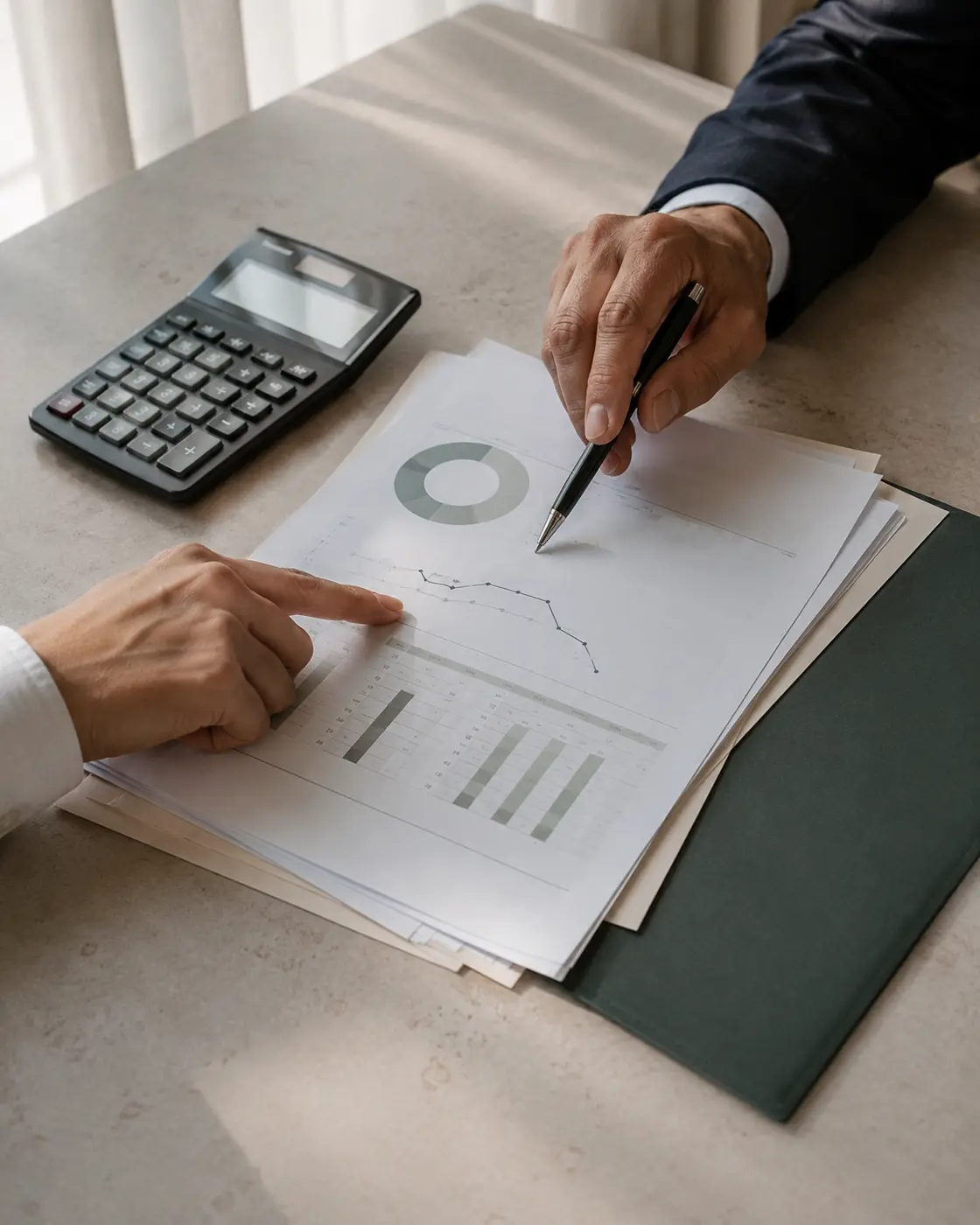Two professionals reviewing financial information together