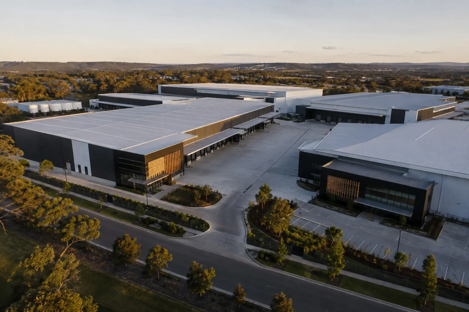 An elevated view of a portfolio of modern industrial warehouses and logistics properties.